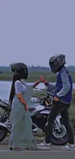 Romantic bikers holding hands with helmets and motorcycle.