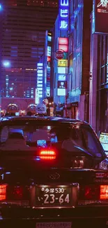 Tokyo street at night with neon lights and taxi.