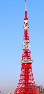 Tokyo Tower with a bright blue sky backdrop.