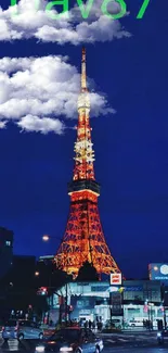 Tokyo Tower brightly illuminated at night against a dark blue sky.