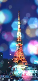 Tokyo Tower glowing in the night with vibrant city lights.