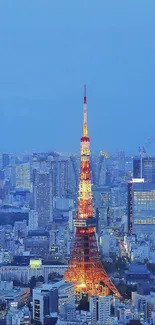 Tokyo Tower illuminated at night with city skyline.