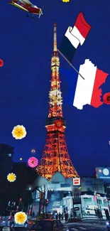 Tokyo Tower with flowers and flags in a night cityscape.