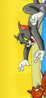 Tom and Jerry cartoon wallpaper with a yellow background.