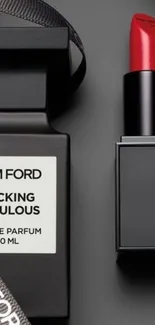 Tom Ford perfume with red lipstick on black background.