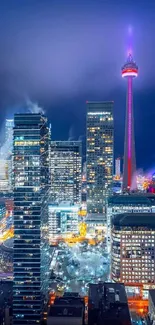 Toronto skyline at night with vibrant city lights and iconic tower glowing.