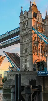 Tower Bridge in London during sunset with open drawbridge.