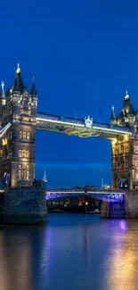 Tower Bridge beautifully illuminated at night over the Thames.