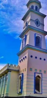 Elegant white and blue tower under a vivid blue sky landscape.