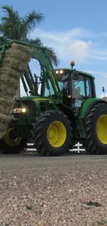 Green tractor on rural road under blue sky.