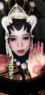 Traditional bridal beauty with henna design and elegant attire.