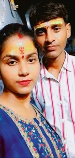 Traditional couple portrait with colorful attire.