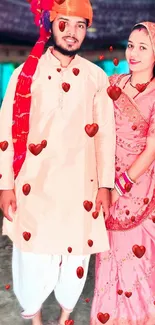 Couple in traditional Indian attire with hearts.