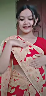 Woman in traditional red sari indoors