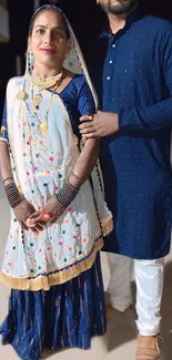 Couple in traditional Indian attire for a festive occasion.