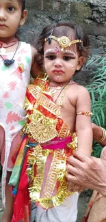 Children in traditional festive attire for mobile wallpaper.