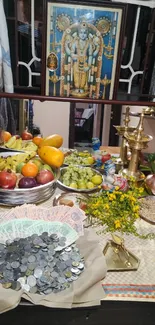 Colorful Indian festival setup with fruits and coins.