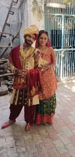 Traditional Indian wedding couple in vibrant attire.