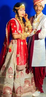 Indian wedding couple in traditional attire with rich colors.