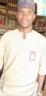 Person in traditional attire inside a shop.