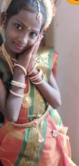 Girl in traditional South Indian attire with jewelry.