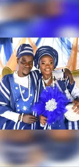 Couple in traditional attire at a vibrant wedding.