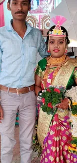 Traditional wedding couple in colorful attire.