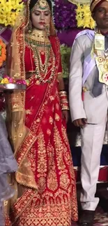 A vibrant Indian wedding with bride in red traditional attire.