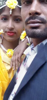 Traditional wedding couple in bright attire.