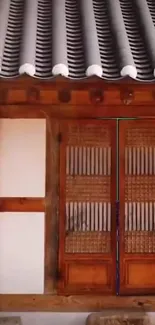 Traditional Korean wooden door with detailed lattice design.