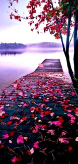 Tranquil lake with autumn leaves and a wooden pier.