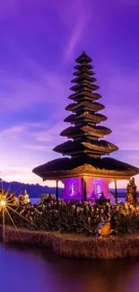 Tranquil Balinese pagoda with purple sunset sky.