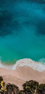 Aerial view of a tranquil beach with blue waters and sandy shores.