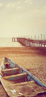 Tranquil beach with vintage boat and wooden pier extending into the sea.