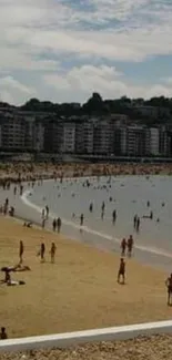 Beach cityscape with people enjoying the shore and skyline in the background.