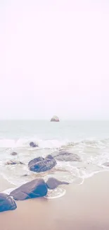 Minimalist beach with rocks and serene pastel colors.