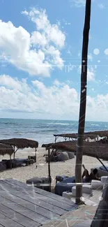 Tranquil beach scene with ocean view under a blue sky.