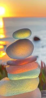 Colorful stones stacked by the sunset beach.