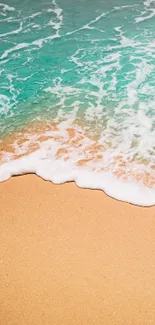 Turquoise waves crash gently onto golden sand.