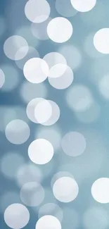 Serene blue bokeh wallpaper with soft white circles.