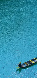 Lone boat on tranquil turquoise water wallpaper.