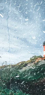 Red and white lighthouse on a scenic coastal landscape with blue sky.