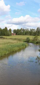 Peaceful countryside with stream and greenery under a soft sky.