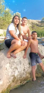 Family enjoying a serene day by the river with a clear blue sky.