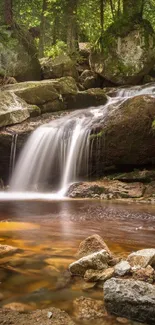 A serene waterfall flows in a lush, green forest with smooth river rocks.