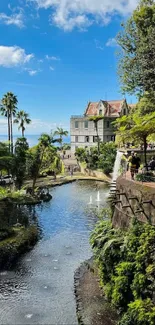 Serene garden with villa, river, and lush greenery under a blue sky.