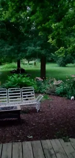 Tranquil garden scene with lush greenery and bench.