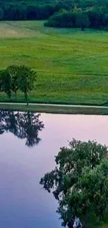 Serene green landscape with reflective lake.