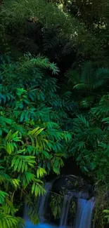 Lush jungle with blue waterfall and green foliage.