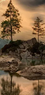 Serene lake with trees and rocks at sunset, perfect for nature wallpaper.